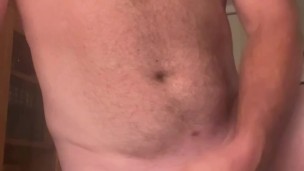 Stocky Bear stokes and plays with his thick cock