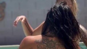 Sexy lesbian makeout with back tattoo visible