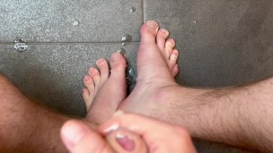Horny soccer player jerks uncut dick and cums on toes