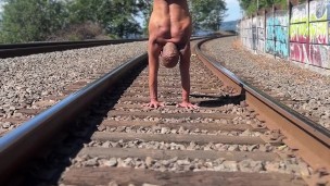 Public Acrobat Handstand in Thong on Train Tracks