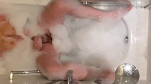 Shemale masturbating in the bathtub