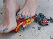 Destroying a model racecar toy with my barefeet smashing it into pieces 15/16