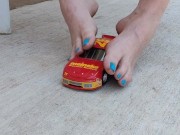 Destroying a model racecar toy with my barefeet smashing it into pieces 4/16
