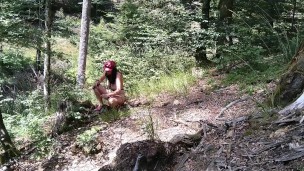 Milf woman with big tits jerking fat dick in the woods