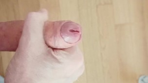 Hairy daddy strokes his leaky dick and plays with his precum