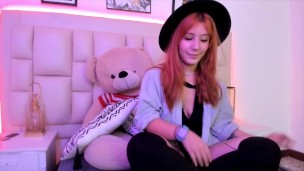 Beautiful horny redhead with a cute face gets very horny and wants to masturbate in bed