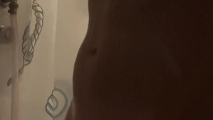 Muscular DILF jerks off in the shower on a hot day