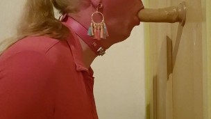 Sissy sucks on a dildo