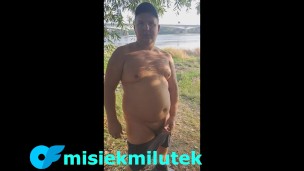 A young Teddy Bear with a small dick is masturbating on the river bank