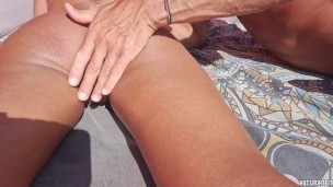 Exhibitionist Couple - Street masturbation - Licking and fingering girl ass in a public beach