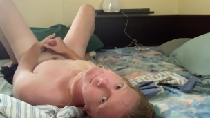 Long-haired twink masturbates for you on a messy bed