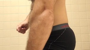 Hairy muscle bear flexing and posing after gym workout