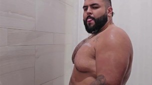 chubby mexican guy with a big dick in the gym showers