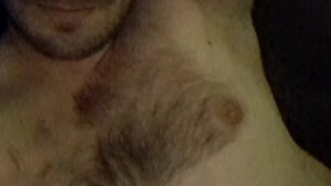 The furry bear behind the lady in red says hey