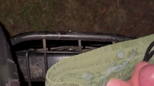 Cumming in park on bike and short