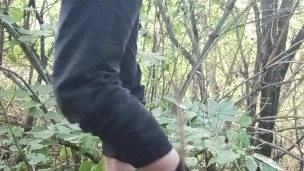 A young guy studies himself in nature