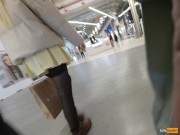 A girl walks in a short skirt without panties in a shopping mall 1/16
