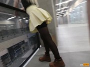 A girl walks in a short skirt without panties in a shopping mall 10/16