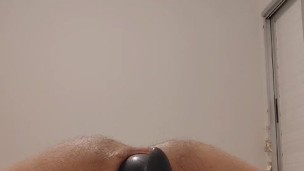 Inflatable plug opens young guy's ass making him gape