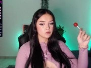 Cute college girl with a cute face looks very sexy while sucking a lollipop 1/16