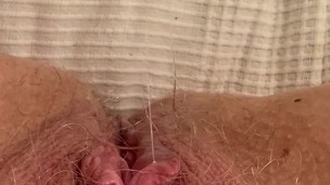 Red nails on a wet dildo