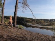Naked girl walks along the river and forest 9/16