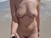 young woman walking naked on a public beach 6/16