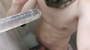 The boy moves his mouth as if he is sucking a real dick