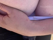 Hand expressing breastmilk at the beach!