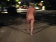 Naked blonde walks on a public street 1/16