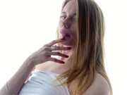 Pretty girl licking her fingers.