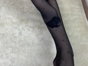 Foot mistress loves to rub her feet in black nylon stockings 4/16