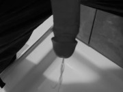 Taking a quick piss on the shower floor, with my semi hard cock 7/16