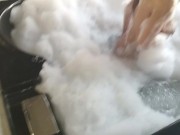 brunette washes her big tits in hydromassage