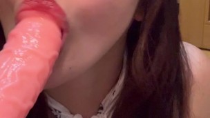 A girl doing naughty things to a toy