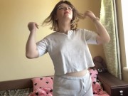 Charming brunette gracefully swaying her hips, showing off her appetizing forms. 1/16