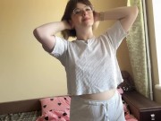 Charming brunette gracefully swaying her hips, showing off her appetizing forms. 2/16