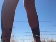 Piss Slut pissing on side of road!