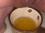 Girl pisses in a coffee cup 15/16