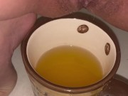 Girl pisses in a coffee cup 16/16