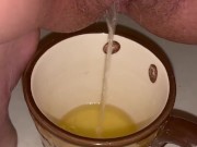 Girl pisses in a coffee cup 3/16