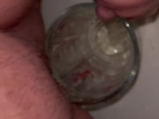 Girl measures her morning piss and overflows the cup 1/16