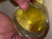 Girl measures her morning piss and overflows the cup 11/16