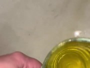 Girl measures her morning piss and overflows the cup 13/16