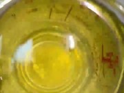 Girl measures her morning piss and overflows the cup 15/16