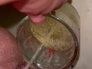 Girl measures her morning piss and overflows the cup 5/16