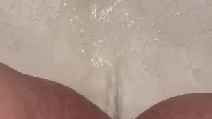 Pussy spread to piss in tub