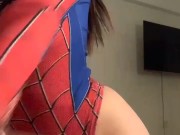 a beautiful girl in a spider-man costume 15/16