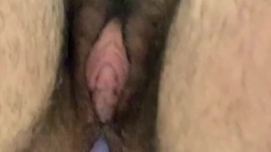 Easing open my ass with a colorful dildo against the shower wall