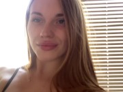 Pretty girl licking her fingers. 1/16